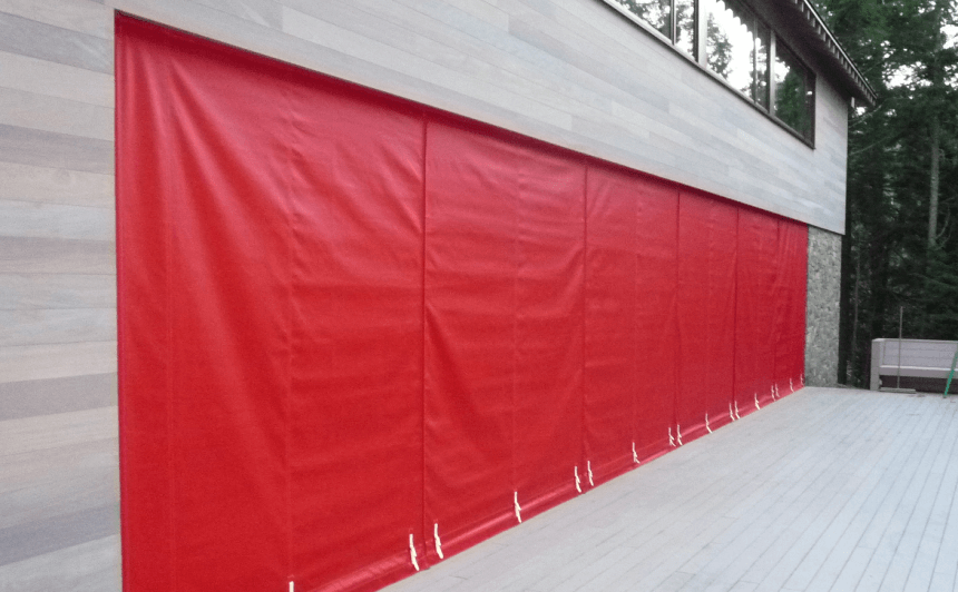 Red wall of canvas covering building windows